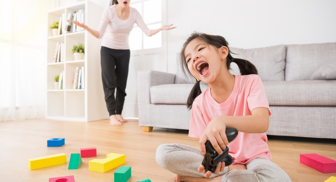 worst mom featured image with child playing video games with upset mom in background