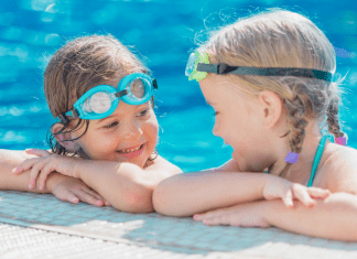 two girls playing in the pool