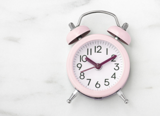 pink clock on a marble background