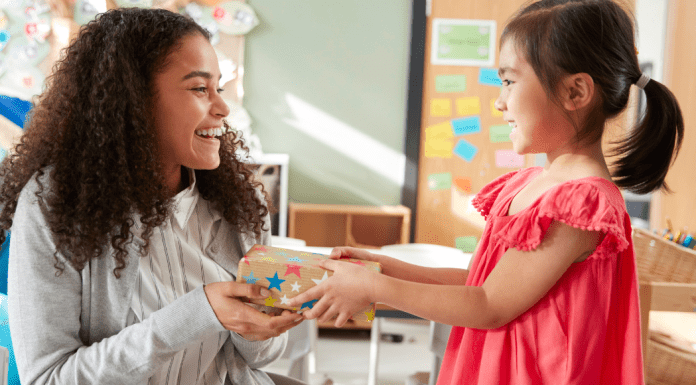 Teacher Appreciation Featured Image with a young student giving a gift to her teacher