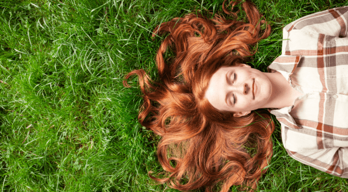 woman laying in the grass