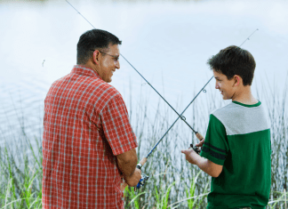 father and son fishing at a lake