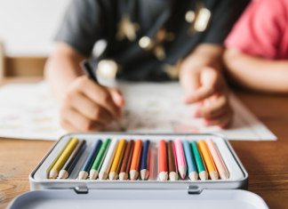 Kids using colored pencils in their homeschool program
