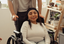 woman in a wheelchair smiling