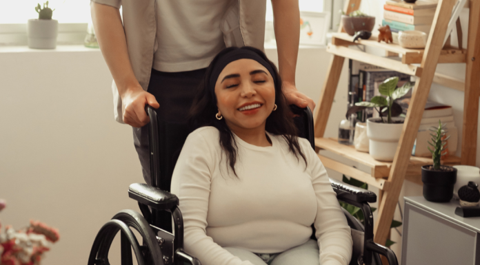 woman in a wheelchair smiling
