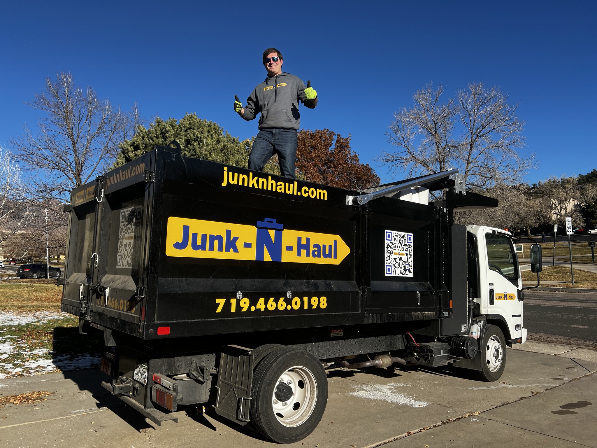 Junk-N-Haul employee with dump truck.