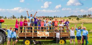 Colorado Kids Ranch group photo with staff and kids on a hay ride