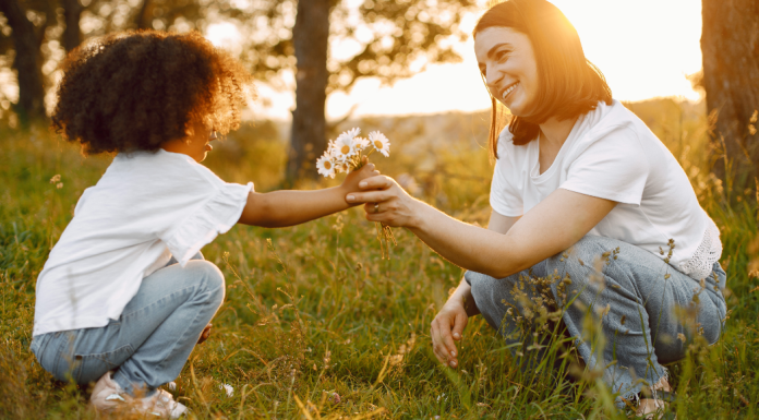 spring mindfulness with a mom and child picking flowers